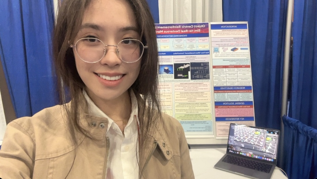 May with her robot manipulation research poster